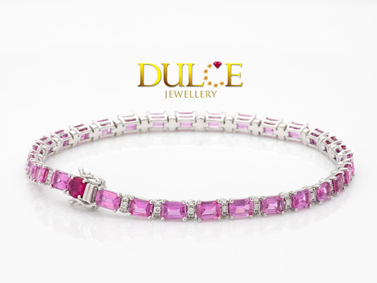 "Super vibrant pink sapphire bracelet set in a delicate gold or silver band."