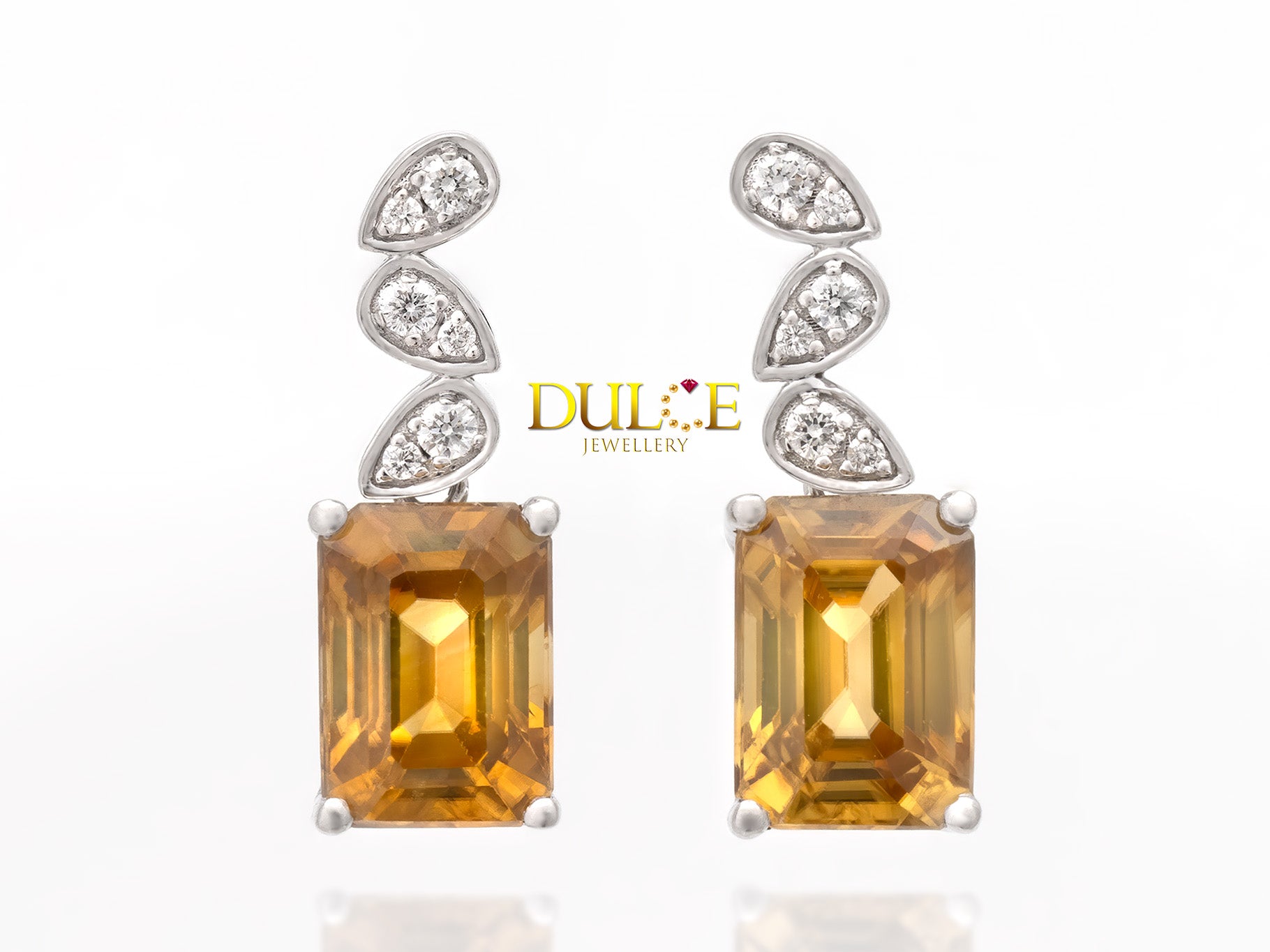 Stunning earrings featuring vibrant brown zircon with sparkling diamonds, set in a delicate and elegant design