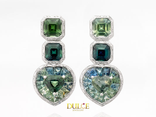 "Green sapphire featuring a heart shape, complemented by cushion-cut and asscher-cut green sapphire in an elegant setting."