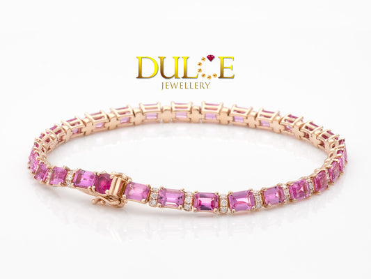 "Super vibrant pink sapphire bracelet set in a delicate gold or silver band."